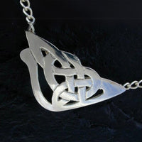 larger celtic open work design in a semi-circle triangular shape attached to a belcher sterling silver chain