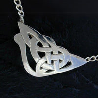 larger celtic open work design in a semi-circle triangular shape attached to a belcher sterling silver chain