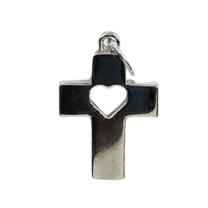 small cross around 20mm high and 14mm across. At the top there is a small u ring to which a jump ring is attached. A shape of a heart is cut out of the intersection between the vertical and horizontal posts. The outline of the cross is approsimately 3mm wide and 1mm thick. The finish is shiny.