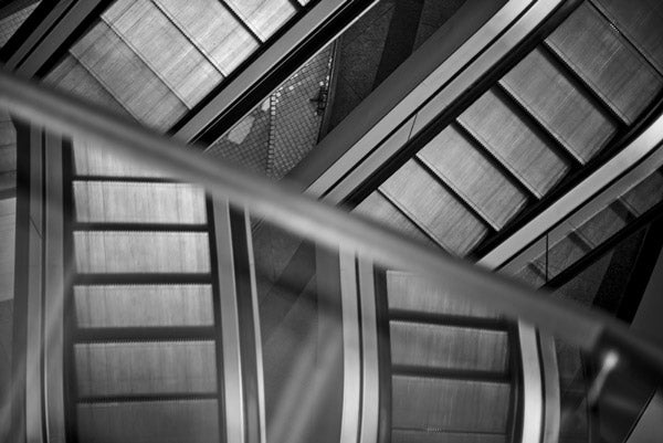 Black and white Escher inspired picture of escalators in Victoria Square Belfast